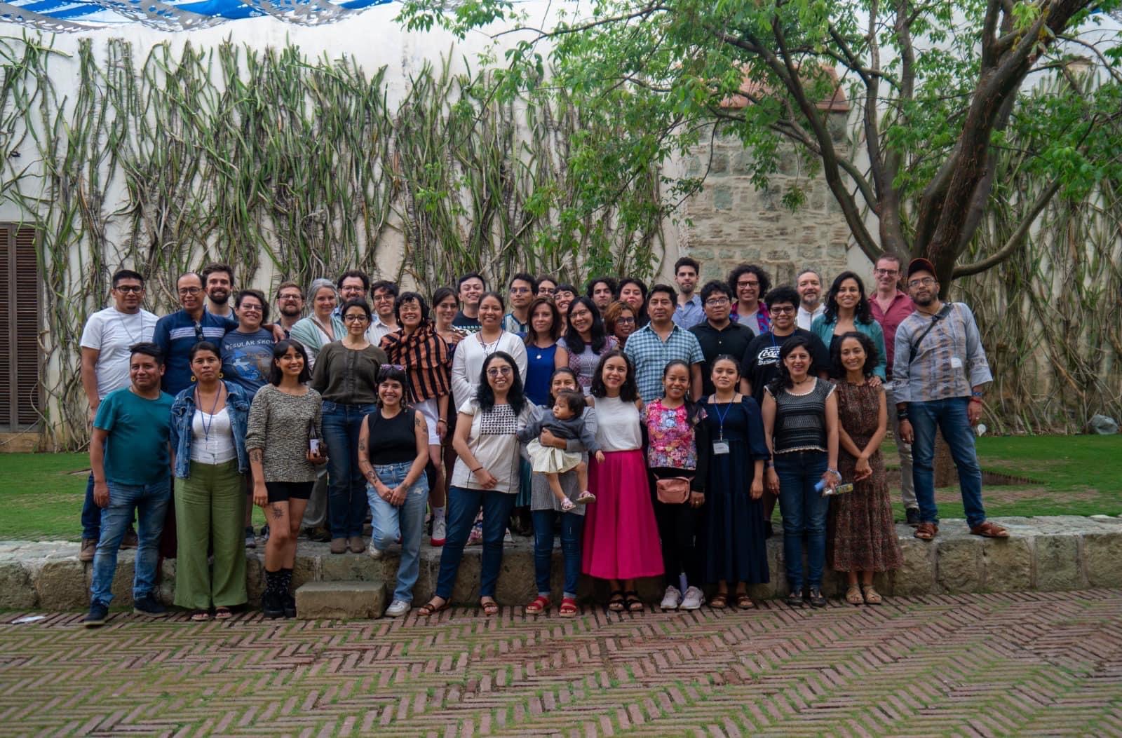 students in the class gather for a group photo outdoors